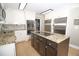 Bright kitchen with stainless appliances, granite countertops, and a dark brown island at 100 N Gateshead Xing, Goose Creek, SC 29445