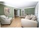 Comfortable living room with wood floors, neutral decor, and a view of the hallway at 100 N Gateshead Xing, Goose Creek, SC 29445