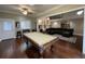 Spacious billiards room featuring hardwood floors and opening to a living room at 100 N Gateshead Xing, Goose Creek, SC 29445