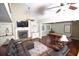 Inviting living room with a fireplace, plush seating, and a billiards table at 100 N Gateshead Xing, Goose Creek, SC 29445