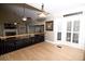 Open-concept living room with a fireplace, hardwood floors, and large windows at 100 N Gateshead Xing, Goose Creek, SC 29445
