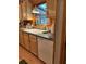 Functional kitchen featuring a classic white sink, ample counter space, and a modern dishwasher beneath light wood cabinetry at 1020 Welles Ln, Walterboro, SC 29488