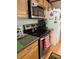 Kitchen area featuring modern stainless steel appliances, including a microwave and oven, complemented by light wood cabinetry at 1020 Welles Ln, Walterboro, SC 29488
