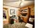 Dedicated office space with classic wooden desk, chair, and plenty of natural light at 1020 Welles Ln, Walterboro, SC 29488