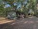 Small storage shed, located in the backyard with mature trees at 1020 Welles Ln, Walterboro, SC 29488