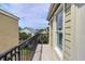View from the balcony, surrounded by houses and palm trees, with blue skies above at 103 Grand Pavilion Blvd, Isle of Palms, SC 29451