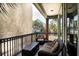 Relaxing balcony features comfortable seating and provides a private outdoor space with neighborhood views at 103 Grand Pavilion Blvd, Isle of Palms, SC 29451