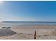 Picturesque beach scene with turquoise water, clear blue skies, and sandy shores perfect for relaxation at 103 Grand Pavilion Blvd, Isle of Palms, SC 29451
