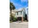 Charming coastal home featuring unique architectural details, a brick foundation, and convenient parking at 103 Grand Pavilion Blvd, Isle of Palms, SC 29451