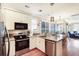 Well-lit kitchen features stainless steel appliances, granite countertops, and a convenient breakfast area at 103 Grand Pavilion Blvd, Isle of Palms, SC 29451