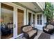 Cozy patio features comfortable wicker seating, perfect for enjoying the outdoors in a private setting at 103 Grand Pavilion Blvd, Isle of Palms, SC 29451