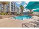 Inviting pool area with lounge chairs, tropical landscaping, and resort-style amenities at 103 Grand Pavilion Blvd, Isle of Palms, SC 29451