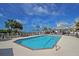 Inviting community pool area with ample seating, lush landscaping, and a serene coastal vibe at 103 Grand Pavilion Blvd, Isle of Palms, SC 29451