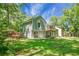 Charming home with a spacious backyard and a wooden balcony that's surrounded by lush greenery at 105 Brailsford Rd, Summerville, SC 29485