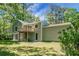 Charming home with a spacious backyard and a wooden balcony that's surrounded by lush greenery at 105 Brailsford Rd, Summerville, SC 29485