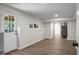 An open basement with vinyl floors, white walls, and an exterior door to the backyard at 105 Brailsford Rd, Summerville, SC 29485