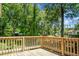 Wood deck overlooking a lush backyard and mature trees, great for outdoor living at 105 Brailsford Rd, Summerville, SC 29485