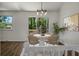 Cozy dining area with a round marble table, four chairs, and a sliding glass door leading to a deck at 105 Brailsford Rd, Summerville, SC 29485