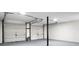 Spacious garage with two-car capacity, clean white walls, and epoxy flooring at 105 Brailsford Rd, Summerville, SC 29485