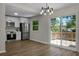 Eat-in kitchen with stainless steel appliances, white cabinets, and sliding glass doors to deck at 105 Brailsford Rd, Summerville, SC 29485