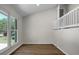 Bright living room with large windows, vaulted ceilings, and minimalist decor at 105 Brailsford Rd, Summerville, SC 29485