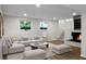 Spacious living room with a fireplace, neutral decor, and a comfortable white sofa at 105 Brailsford Rd, Summerville, SC 29485