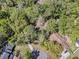Aerial view of a house surrounded by lush trees and a well-maintained neighborhood at 106 Spring Farm Pl, Summerville, SC 29485