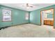This spacious bedroom features two large windows and an en-suite bathroom, offering comfort and convenience at 106 Spring Farm Pl, Summerville, SC 29485