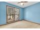 Bright bedroom with serene blue walls and a large window, creating a tranquil and inviting atmosphere at 106 Spring Farm Pl, Summerville, SC 29485