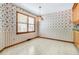 Cozy dining area with large windows, vintage wallpaper, and tile flooring at 106 Spring Farm Pl, Summerville, SC 29485