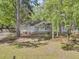 Quaint brick and siding home with well-maintained lawn and landscaping shaded by mature trees at 106 Spring Farm Pl, Summerville, SC 29485