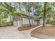 A single-story home with attached garage, featuring a brick and siding exterior and manicured front yard at 106 Spring Farm Pl, Summerville, SC 29485