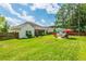 Home exterior with expansive backyard and storage shed at 107 Towering Pine Dr, Ladson, SC 29456