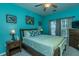 Cozy bedroom with wooden furniture, lamps, and bright blue walls at 107 Towering Pine Dr, Ladson, SC 29456