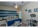 Charming bedroom with blue accents, white furniture and nautical decor at 107 Towering Pine Dr, Ladson, SC 29456