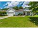 Charming one-story home with a well-kept lawn and convenient two-car garage at 107 Towering Pine Dr, Ladson, SC 29456