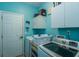Bright laundry room equipped with modern washer and dryer units and ample storage at 107 Towering Pine Dr, Ladson, SC 29456