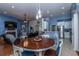 Open-concept living space connecting a modern kitchen and a comfortable sitting room at 107 Towering Pine Dr, Ladson, SC 29456