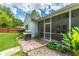 A lovely screened porch off the back with a nice grill and a pleasant view of the outdoors at 107 Towering Pine Dr, Ladson, SC 29456