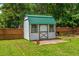 Yard featuring a garden shed with a green metal roof at 107 Towering Pine Dr, Ladson, SC 29456