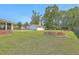 Well-manicured backyard with a large two-car detached garage at 109 Winston Way, Goose Creek, SC 29445