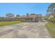 Backyard featuring a sunroom and expansive driveway at 109 Winston Way, Goose Creek, SC 29445