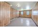 Basement with panelled walls, two windows and a painted concrete floor at 109 Winston Way, Goose Creek, SC 29445