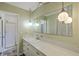 Bathroom featuring a shower, vanity, light fixtures, and a large mirror at 109 Winston Way, Goose Creek, SC 29445