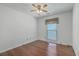 Bedroom featuring wood floors, ceiling fan, and window with patterned curtains at 109 Winston Way, Goose Creek, SC 29445