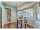 Charming dining nook featuring bay windows, a round table, and hardwood floors at 109 Winston Way, Goose Creek, SC 29445