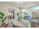 Charming dining area with a stylish chandelier, a hardwood floor, and a view to the living room at 109 Winston Way, Goose Creek, SC 29445