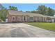 Charming brick home featuring a well-manicured lawn and long driveway, offering curb appeal at 109 Winston Way, Goose Creek, SC 29445