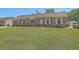 Charming brick ranch-style home featuring a well-maintained lawn, shuttered windows, and a detached garage at 109 Winston Way, Goose Creek, SC 29445