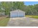 Two-car detached garage with a long concrete driveway at 109 Winston Way, Goose Creek, SC 29445